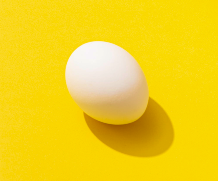 Egg on Yellow Background